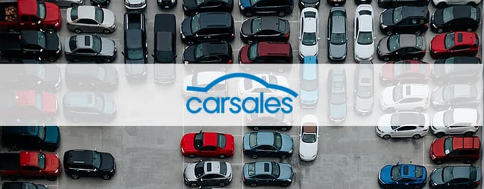 Carsales logo over parked cars image