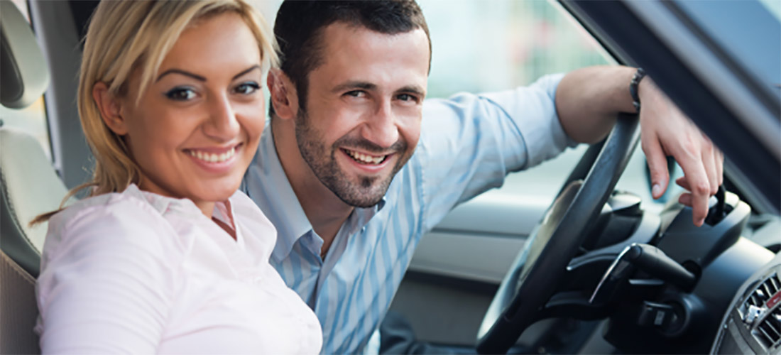 Smiling couple inside of car - Cars Brisbane